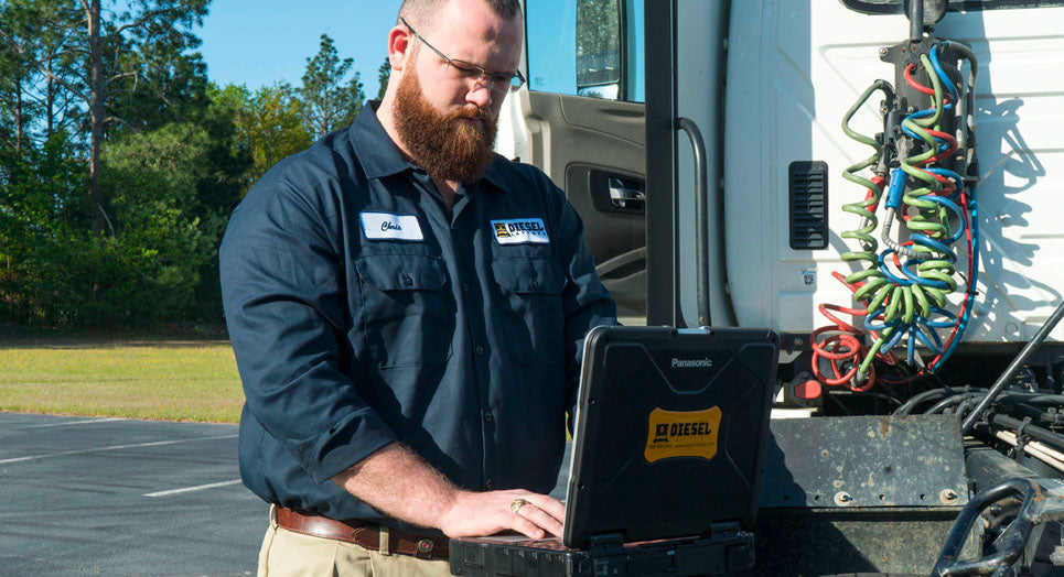 Diesel Tech diagnosing truck